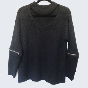 Woman’s black sweater